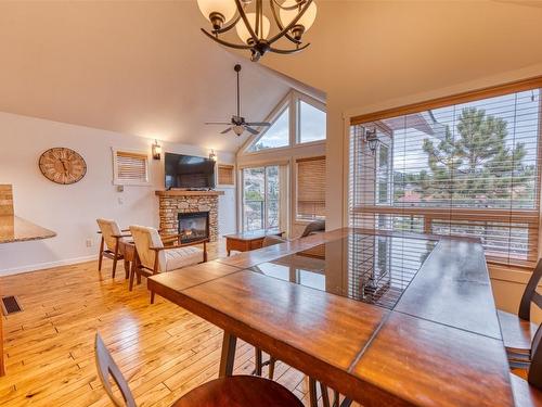 355-6819 Madrid Way, Kelowna, BC - Indoor Photo Showing Dining Room With Fireplace