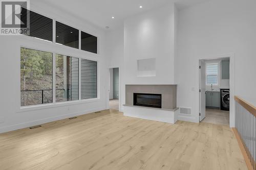 1960 Northern Flicker Court Unit# 16, Kelowna, BC - Indoor Photo Showing Other Room With Fireplace