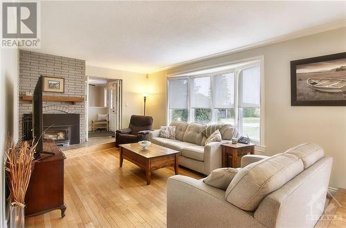 1532 Bella Vista Drive, Cumberland, ON - Indoor Photo Showing Living Room With Fireplace
