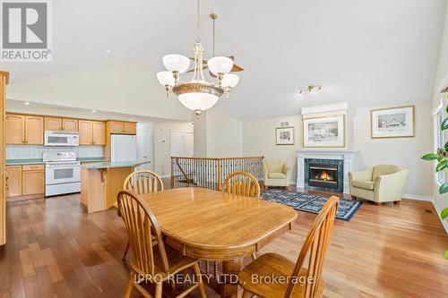 12 - 21 Loretta Drive, Niagara-On-The-Lake, ON - Indoor Photo Showing Dining Room With Fireplace