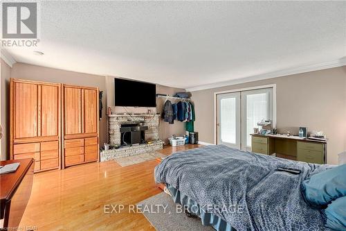 Imported from itso - 3043 Westminster Drive, London, ON - Indoor Photo Showing Bedroom With Fireplace