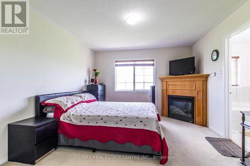 39 - 6399 Spinnaker Circle, Mississauga, ON - Indoor Photo Showing Bedroom With Fireplace