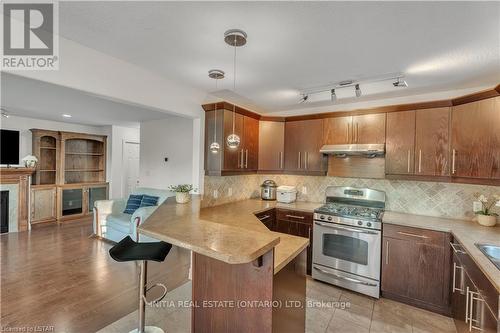 1833 Devos Drive, London, ON - Indoor Photo Showing Kitchen With Fireplace