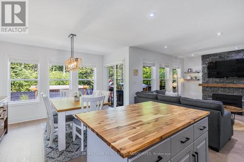 11 55Th Street S, Wasaga Beach, ON - Indoor Photo Showing Dining Room With Fireplace