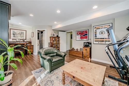 Family room with Heated floor, office nook, Murphy bed, laundry, 3 piece bath, and walk out to massive garage and gorgeous backyard. - 5255 Dryden Avenue, Burlington, ON - Indoor