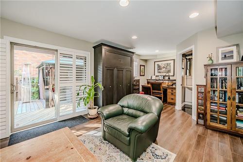 Spacious, bright, afternoon sun in family room. Murphy bed folds down for extra family or guests staying the night - 5255 Dryden Avenue, Burlington, ON - Indoor