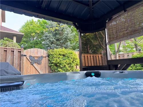 Relax in your Canada Spa company Victoria Model Hot Tub. - 5255 Dryden Avenue, Burlington, ON - Outdoor With Exterior