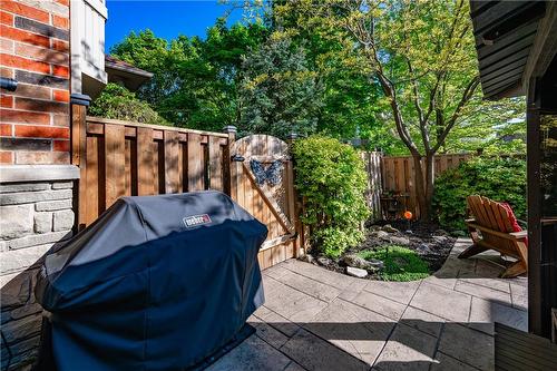 Follow the stamped concrete through the gate to the front treed yard. - 5255 Dryden Avenue, Burlington, ON - Outdoor