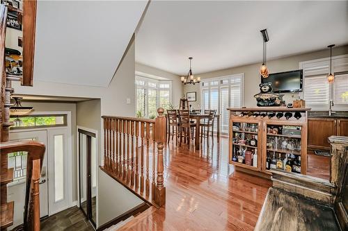 Hardwood floors and island with built in wine cabinet and lots of storage. - 5255 Dryden Avenue, Burlington, ON - Indoor