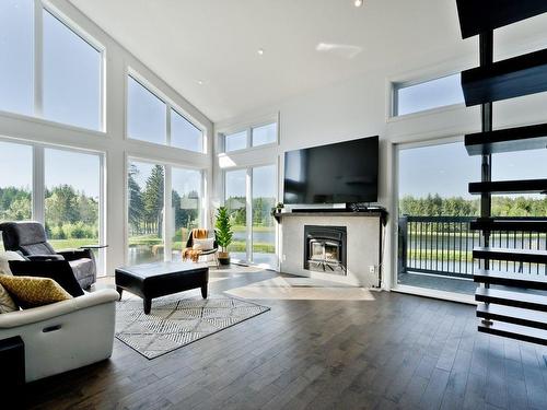 Living room - 80 Ch. Lebel, Saint-Herménégilde, QC - Indoor Photo Showing Living Room With Fireplace