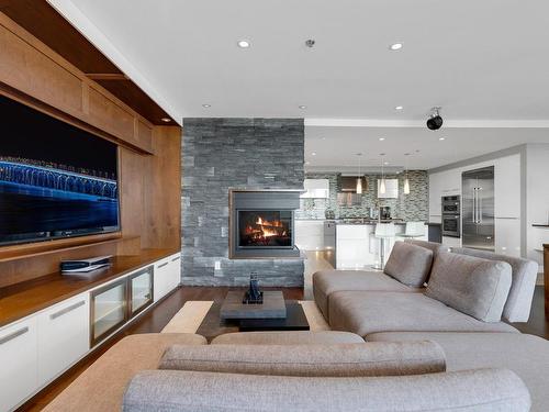 Salon - 1102-2875 Av. Du Cosmodôme, Laval (Chomedey), QC - Indoor Photo Showing Living Room With Fireplace