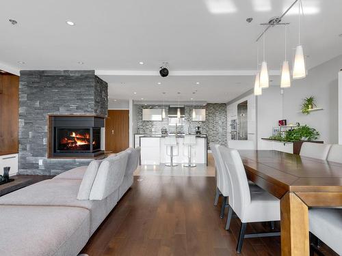 Cuisine - 1102-2875 Av. Du Cosmodôme, Laval (Chomedey), QC - Indoor Photo Showing Dining Room With Fireplace