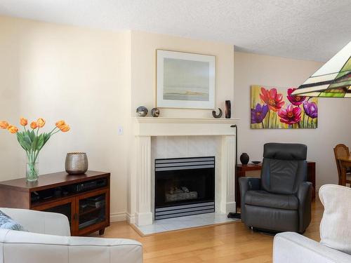 306-1063 Southgate St, Victoria, BC - Indoor Photo Showing Living Room With Fireplace