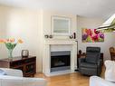 306-1063 Southgate St, Victoria, BC  - Indoor Photo Showing Living Room With Fireplace 