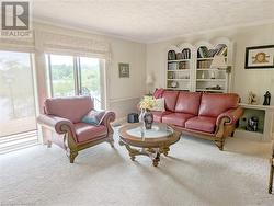 Family room with patio doors to a large balcony - 