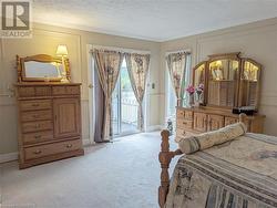 Primary bedroom with patio door to balcony - 