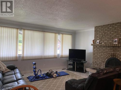 318-320 Alberta Place, Prince Rupert, BC - Indoor Photo Showing Living Room With Fireplace