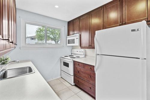 Virtually Staged - 207 Birchcliffe Crescent, Hamilton, ON - Indoor Photo Showing Kitchen