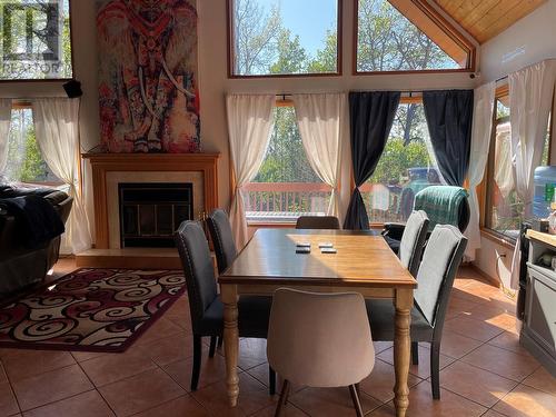 228 Moore Subdivision, Dawson Creek, BC - Indoor Photo Showing Dining Room With Fireplace