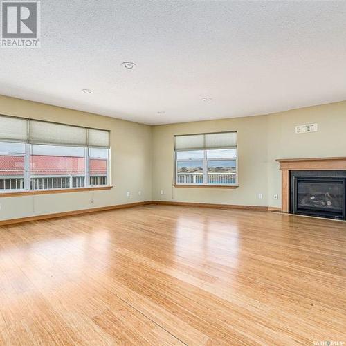 544 Richard Drive, Buffalo Pound Lake, SK - Indoor Photo Showing Living Room With Fireplace