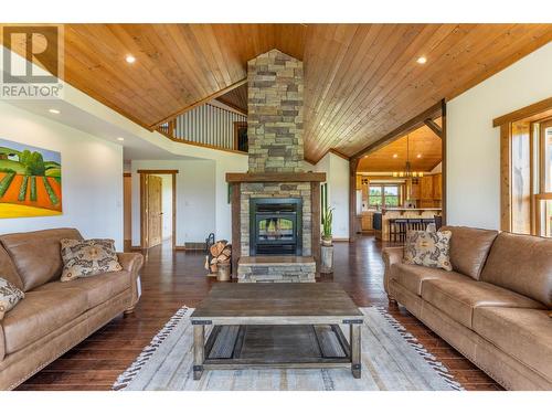 4720 36Th Street, Canyon, BC - Indoor Photo Showing Living Room With Fireplace