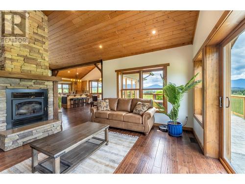 4720 36Th Street, Canyon, BC - Indoor Photo Showing Living Room With Fireplace