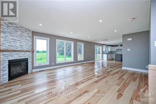 8281 Victoria Street, Ottawa, ON - Indoor Photo Showing Living Room With Fireplace