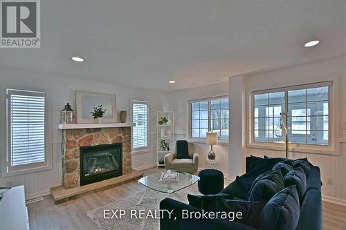 11 Awenda Avenue, Wasaga Beach, ON - Indoor Photo Showing Living Room With Fireplace