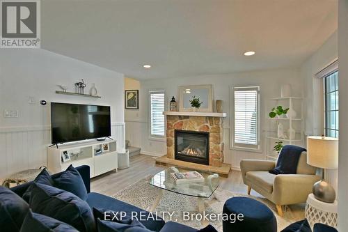 11 Awenda Avenue, Wasaga Beach, ON - Indoor Photo Showing Living Room With Fireplace