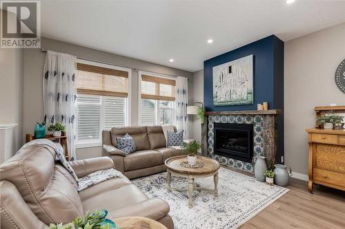 617 Chinook Gate Greenway Sw, Airdrie, AB - Indoor Photo Showing Living Room With Fireplace