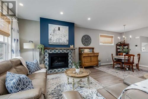 617 Chinook Gate Greenway Sw, Airdrie, AB - Indoor Photo Showing Living Room With Fireplace