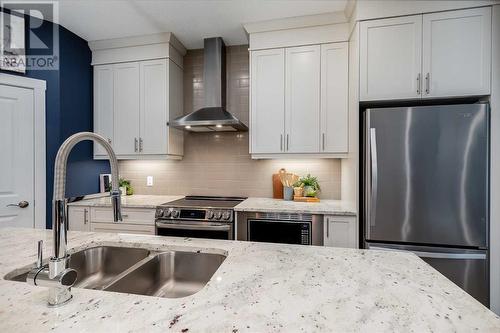 617 Chinook Gate Greenway Sw, Airdrie, AB - Indoor Photo Showing Kitchen With Double Sink With Upgraded Kitchen