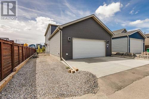 Heated garage with 220 power - 617 Chinook Gate Greenway Sw, Airdrie, AB - Indoor Photo Showing Garage