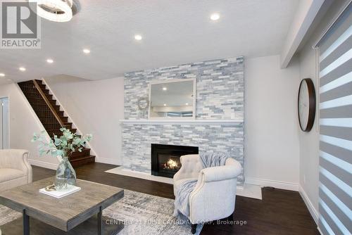 19 Arbour Glen Crescent, London, ON - Indoor Photo Showing Living Room With Fireplace