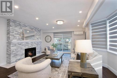 19 Arbour Glen Crescent, London, ON - Indoor Photo Showing Living Room With Fireplace
