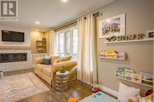 85 Champlin Crescent, Saskatoon, SK - Indoor Photo Showing Living Room With Fireplace