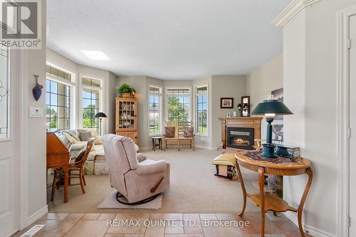 119 Bay Breeze Street, Prince Edward County (Ameliasburgh), ON - Indoor Photo Showing Living Room With Fireplace