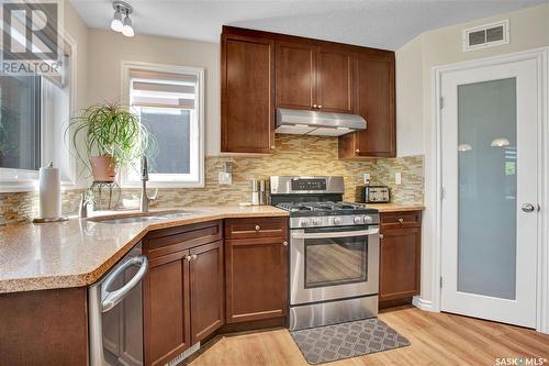 614 Rempel Crescent, Saskatoon, SK - Indoor Photo Showing Kitchen With Double Sink
