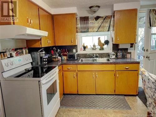 69-73 45E Avenue, Edmundston, NB - Indoor Photo Showing Kitchen With Double Sink