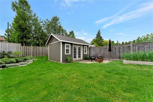 Charming shed that is large enough to store everything - 920 Stone Church Road E, Hamilton, ON - Outdoor With Backyard