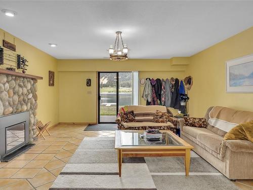 112 Round Lake Road, Princeton, BC - Indoor Photo Showing Living Room With Fireplace