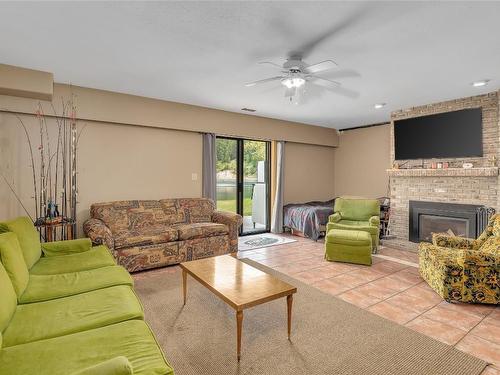 112 Round Lake Road, Princeton, BC - Indoor Photo Showing Living Room With Fireplace