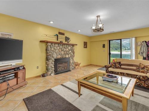 112 Round Lake Road, Princeton, BC - Indoor Photo Showing Living Room With Fireplace