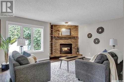 46 Greensboro Drive, Regina, SK - Indoor Photo Showing Living Room With Fireplace