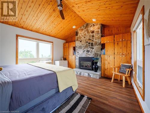 157 Zorra Drive, Tobermory, ON - Indoor Photo Showing Bedroom With Fireplace