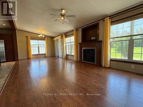 1 Creekside Circle, Kawartha Lakes, ON - Indoor Photo Showing Living Room With Fireplace