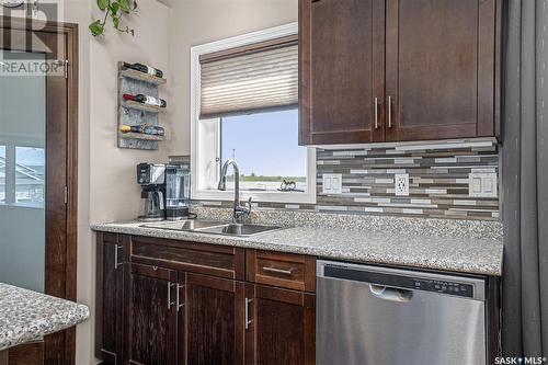 238 Sutter Place, Saskatoon, SK - Indoor Photo Showing Kitchen With Double Sink