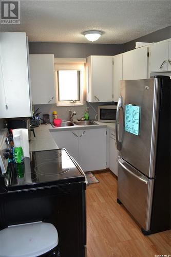 309 1St Avenue W, Kindersley, SK - Indoor Photo Showing Kitchen With Double Sink