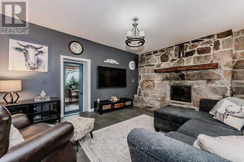 8292 Wilson Street, Guelph/Eramosa, ON - Indoor Photo Showing Living Room With Fireplace