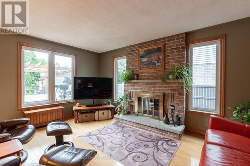 63 Winship Close, London, ON - Indoor Photo Showing Living Room With Fireplace